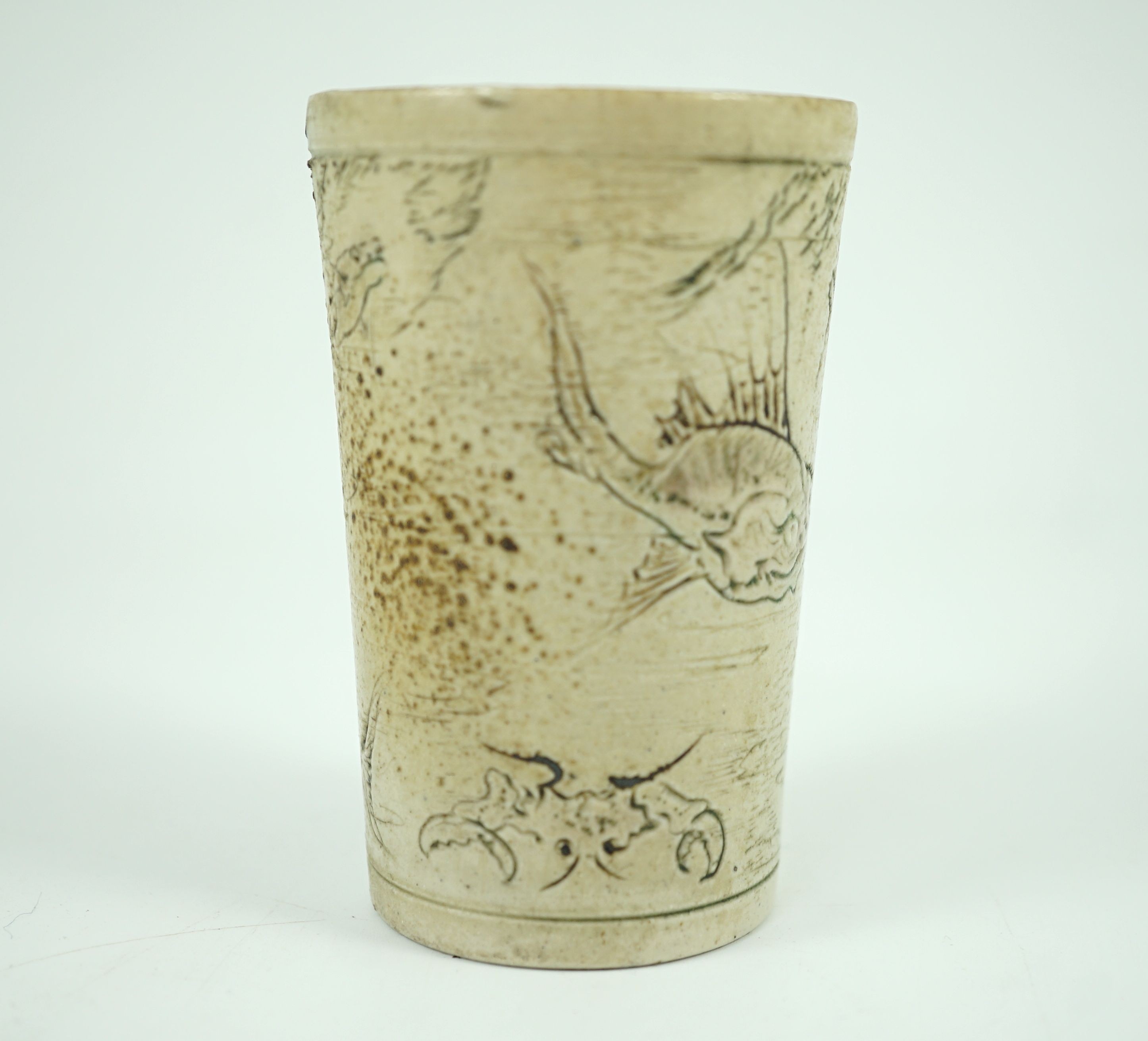 A Martin Brothers ‘grotesque fish’ beaker, dated 1914, 8.7cm high, hairline crack